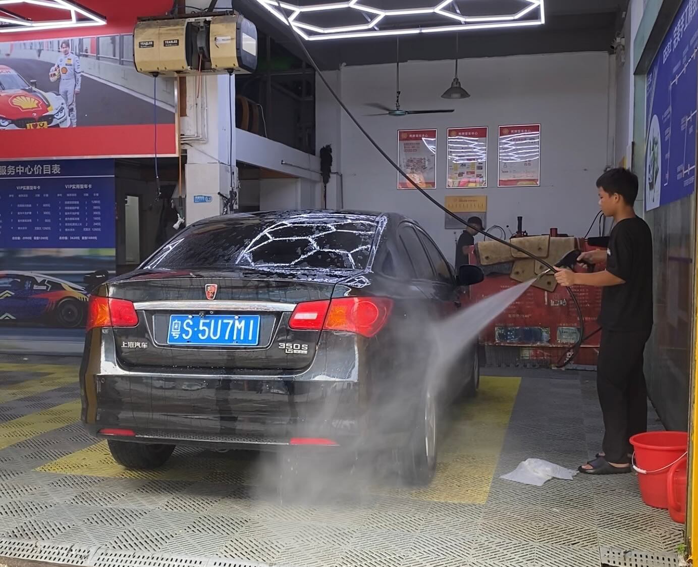 Washing the car after a quick fix.